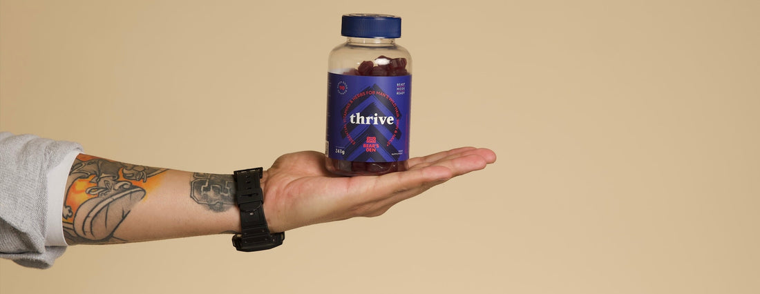 Man holding Thrive hair growth supplement gummies